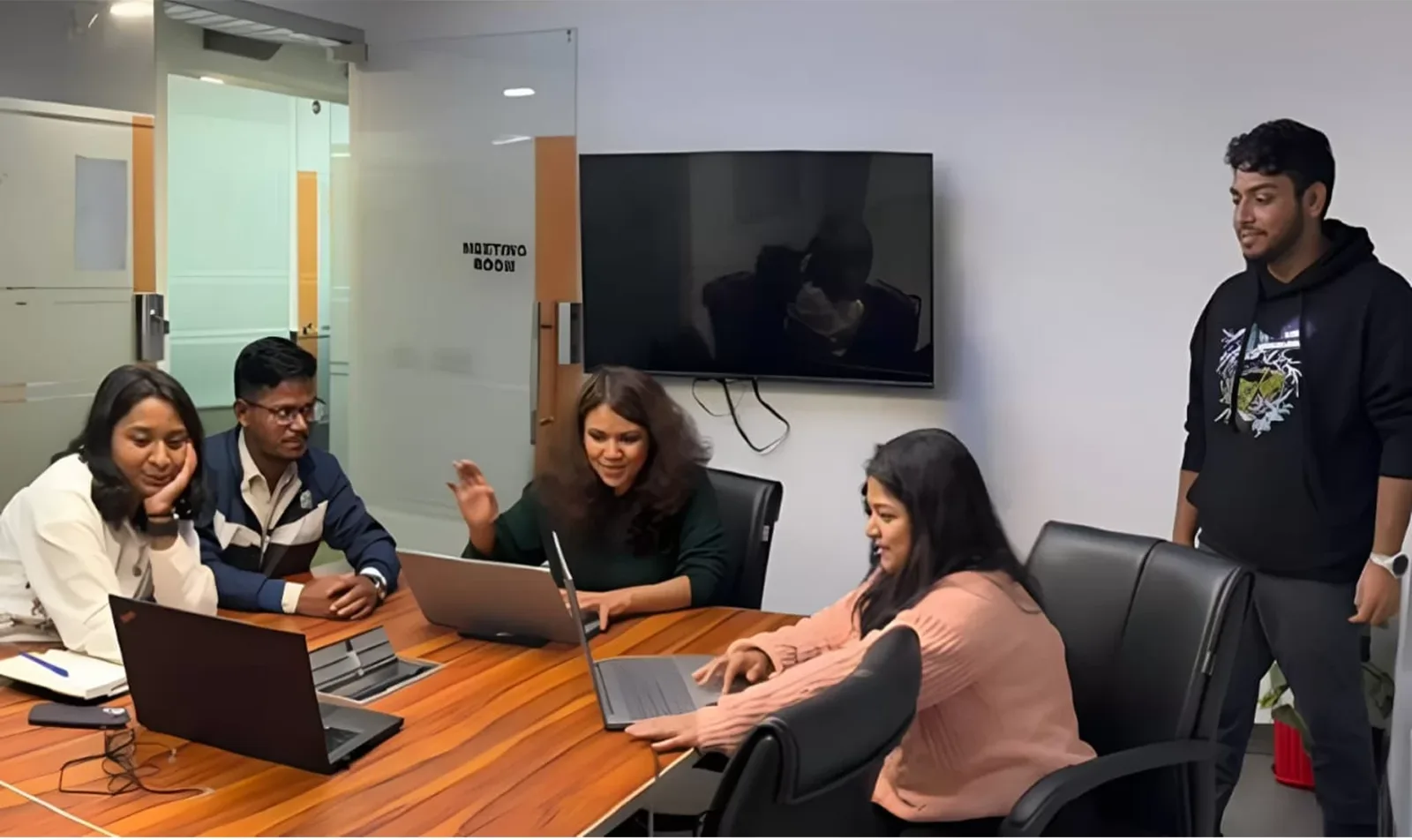 Cybez performance marketing and SEO specialists reviewing campaign data in a client strategy session